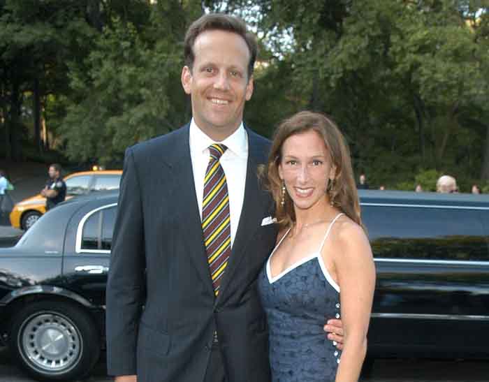 Todd Waterman and his wife Allison Waterman poses for a photo.